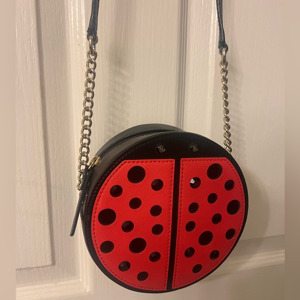 Kate spade ladybug crossbody bag. Gold hardware. Rare. Like new condition.